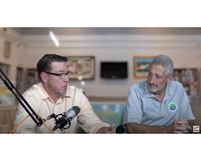Picture of two men talking in a studio